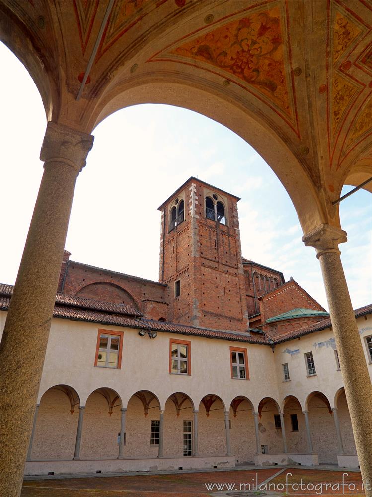 Milan (Italy) - The Basilica of San Simpliciano seen from a colonnade of the Small Cloister